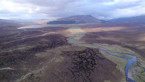 very wide shot of river delta in swampy scotland