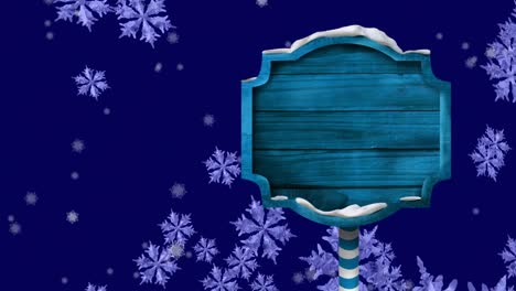 Animación-Digital-De-Un-Cartel-De-Madera-Azul-Contra-Copos-De-Nieve-Cayendo-Sobre-Fondo-Azul