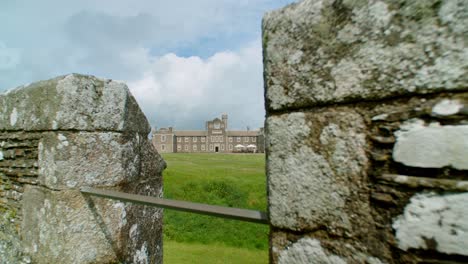 Pendenis-Castle-wide-angle-with-tourists-sunny-day-dolly