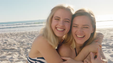 happy woman hugging girl friend on beach giving suprise kiss on cheek best friends having fun summer vacation