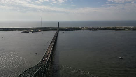 an aerial view of the fire island inlet bridge on a beautiful day