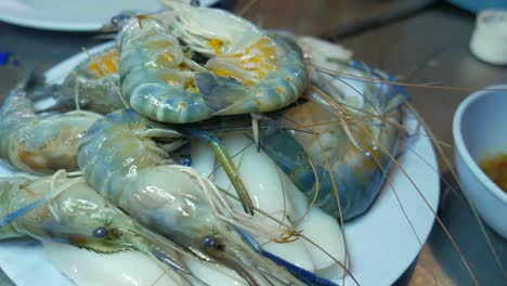 food- raw river prawns with eggs on plate