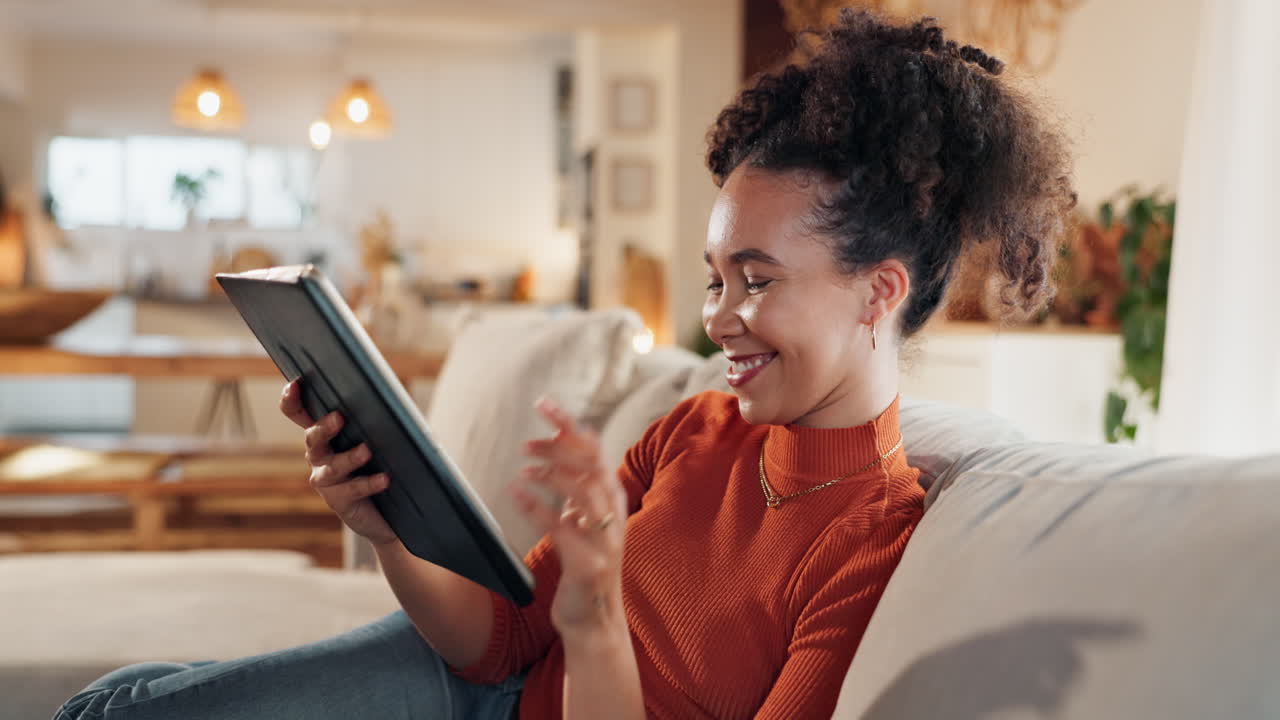 Woman using a tablet at home