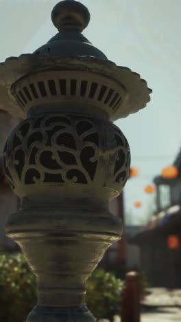 close up of a japanese stone lantern in a garden