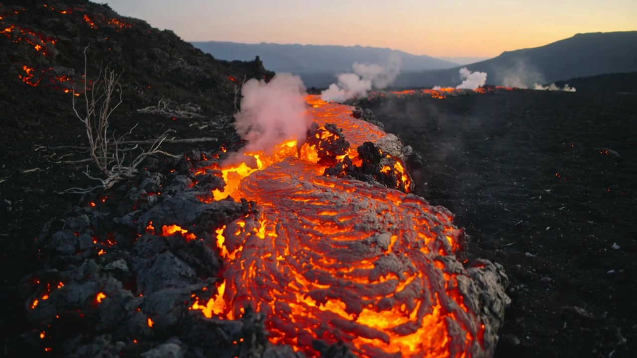 Flowing molten lava channel from vent opening, advancing across volcanic plain, emitting steam