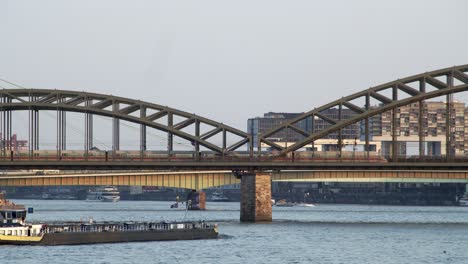 an oil gas tanker passes under the hohenzollern bridge in cologne