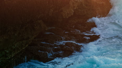 Aqua-flowing-dark-mountain-nature-closeup.-Big-sea-waves-crash-volcanic-rocks