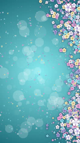 small spring colored flowers on turquoise abstract background. looped holiday animation. floral screensaver in pastel shades. copy space. vertical video.