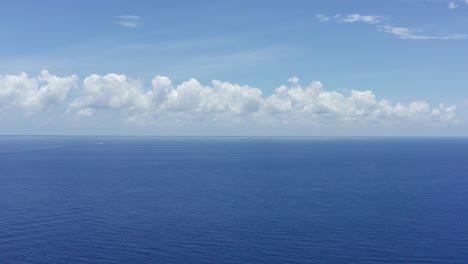 super wide aerial shot across the cozumel channel towards the island of cozumel in quintana roo, mexico