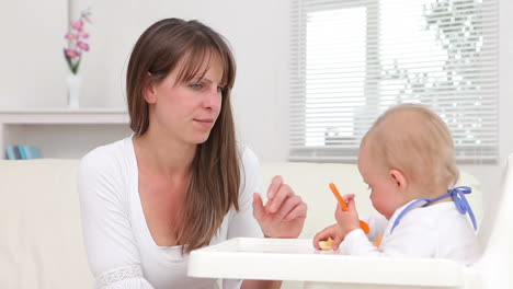 Woman-giving-a-baby-the-banana