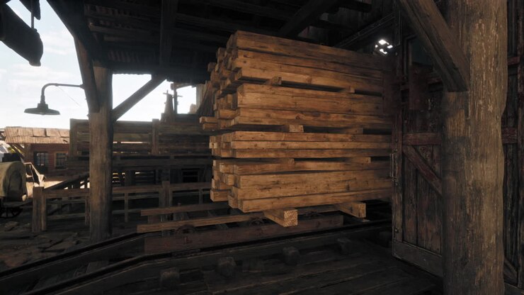 A stack of lumber is stored in an old wooden warehouse