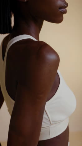 woman in white sports bra and leggings