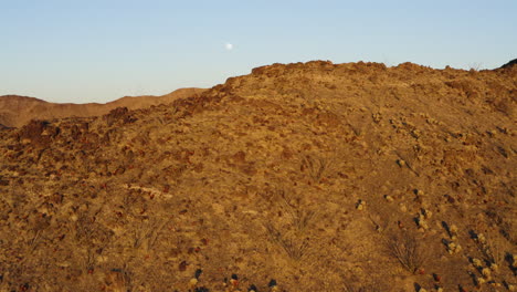 flying over and towards rock mountain peak, reveal vast mountain area, ,red cloud mine, arizona, usa, aerial