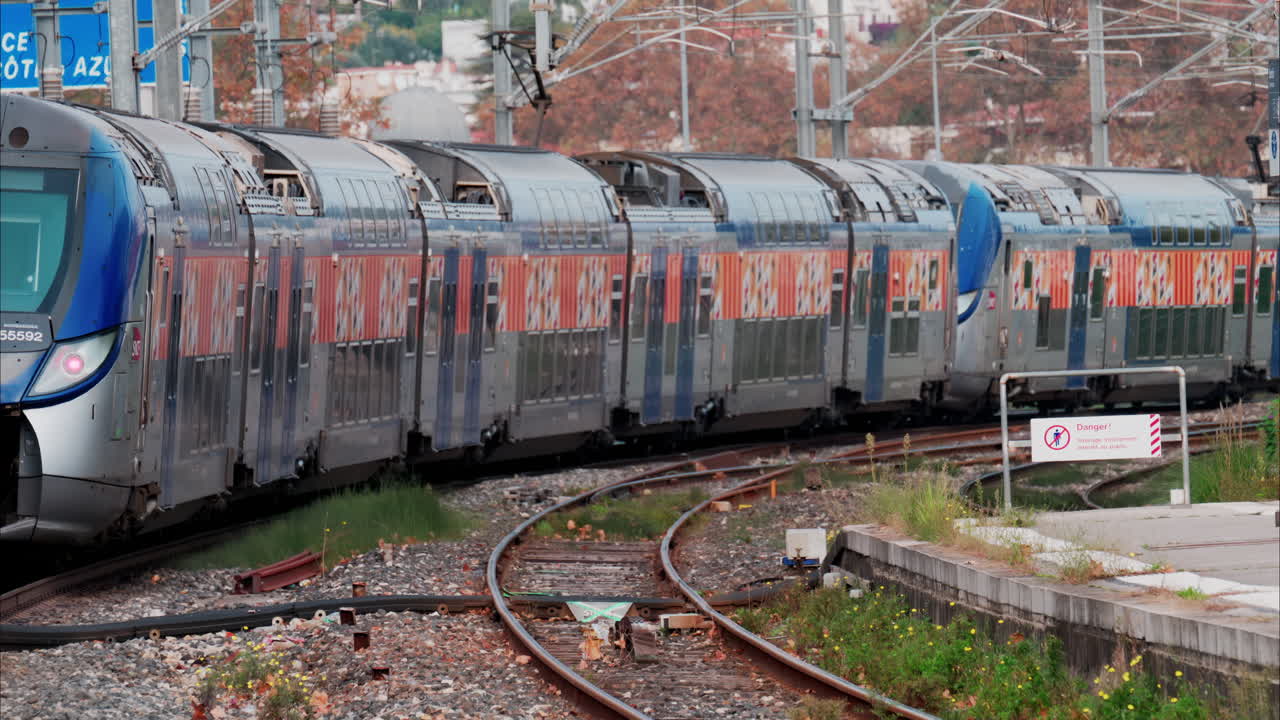 Close up of a blue train moving on the rails in France