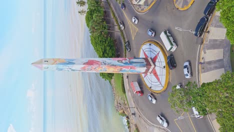 obelisk of santo domingo with sea in background, dominican republic. aerial drone ascending and vertical format