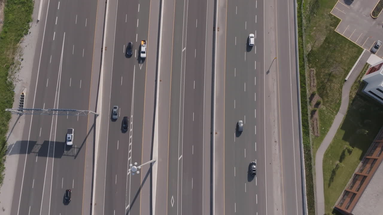 Wide aerial view of Highway 401 in Mississauga, showcasing vehicles on the road