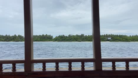 POV-Looking-Out-From-Diving-Boat-Railings-Sailing-Along-sea-in-Maldives