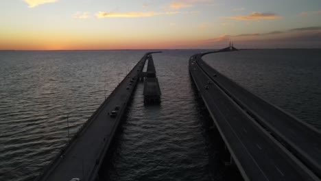 sunset aerial over tampa bay sunshine state skyway and state park fishing pier, florida