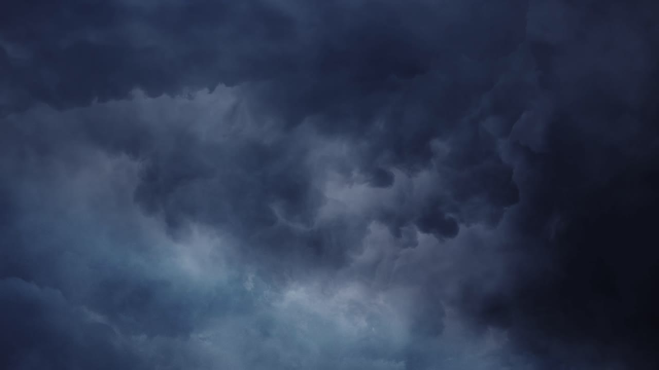 4k thunderstorm, dark cloud clumps in the sky with lightning
