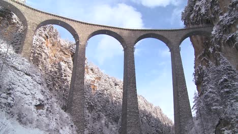 a train in europe crosses a remarkable bridge and plunges directly into a tunnel 1