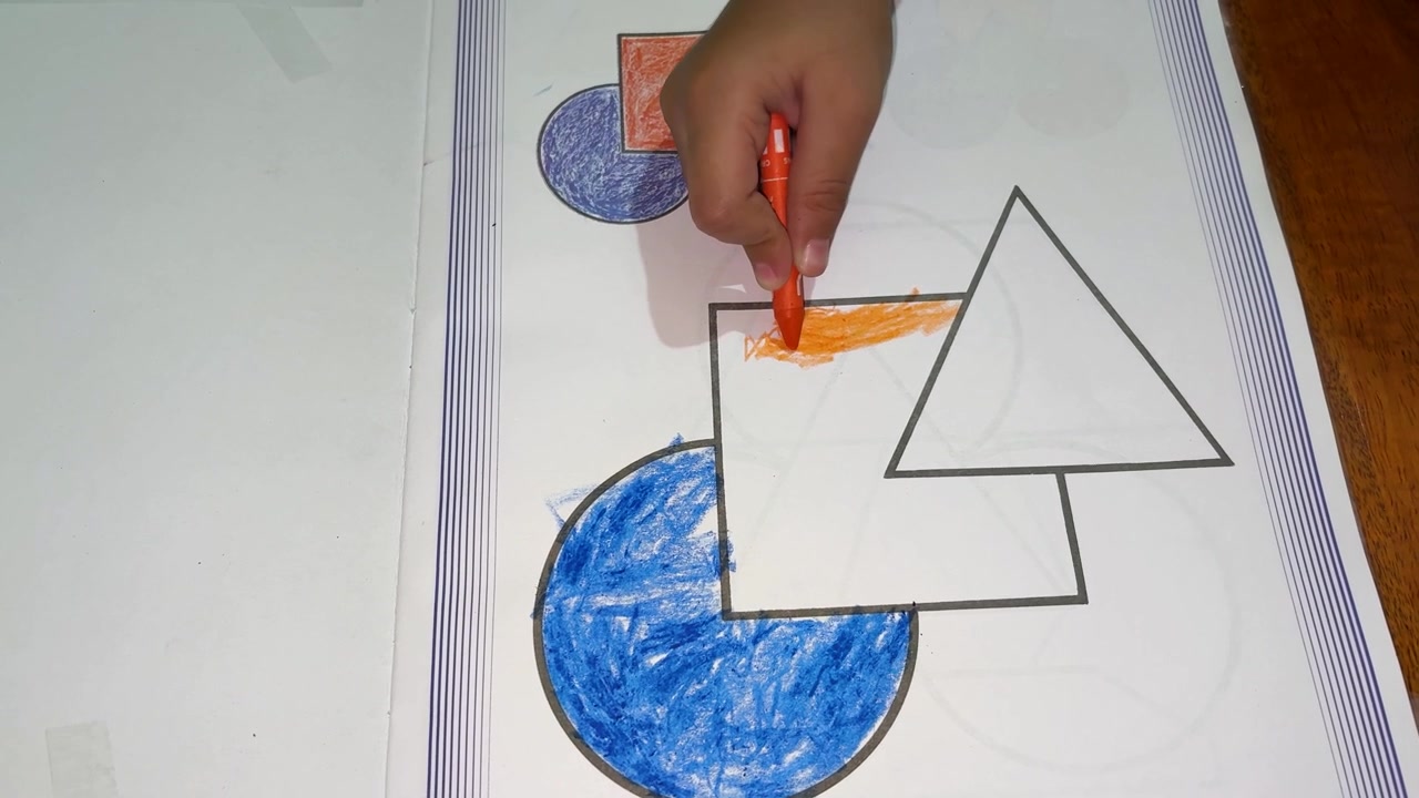 Preschool Child Practicing Drawing And Coloring With Colored Crayon