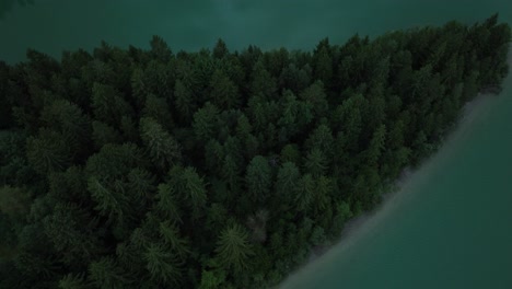 Tilt-up-shot-from-a-little-pier-in-a-lake-up-to-the-sunset-glow-over-the-Forggensee-in-southern-Bavaria