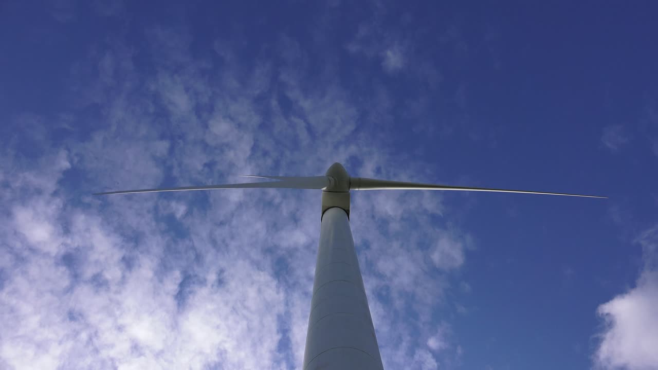 A wind turbine is a device that converts the wind's kinetic energy into electrical energy.