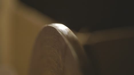 closeup of a electric sander machine disc rotating in a woodworking shop, furniture making industry