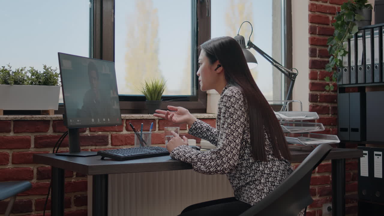 Business woman talking to man on online video call