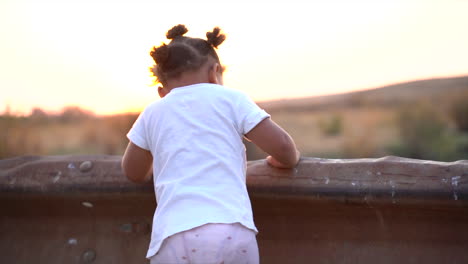 young african girl dancing by herself then turned to write with the sun in the background