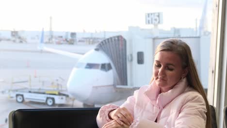a woman faces the challenges of traveling to the airport while waiting for her flight. she finds brief solace in a dream