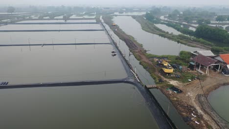 fish farm aerial view with workers and equipment