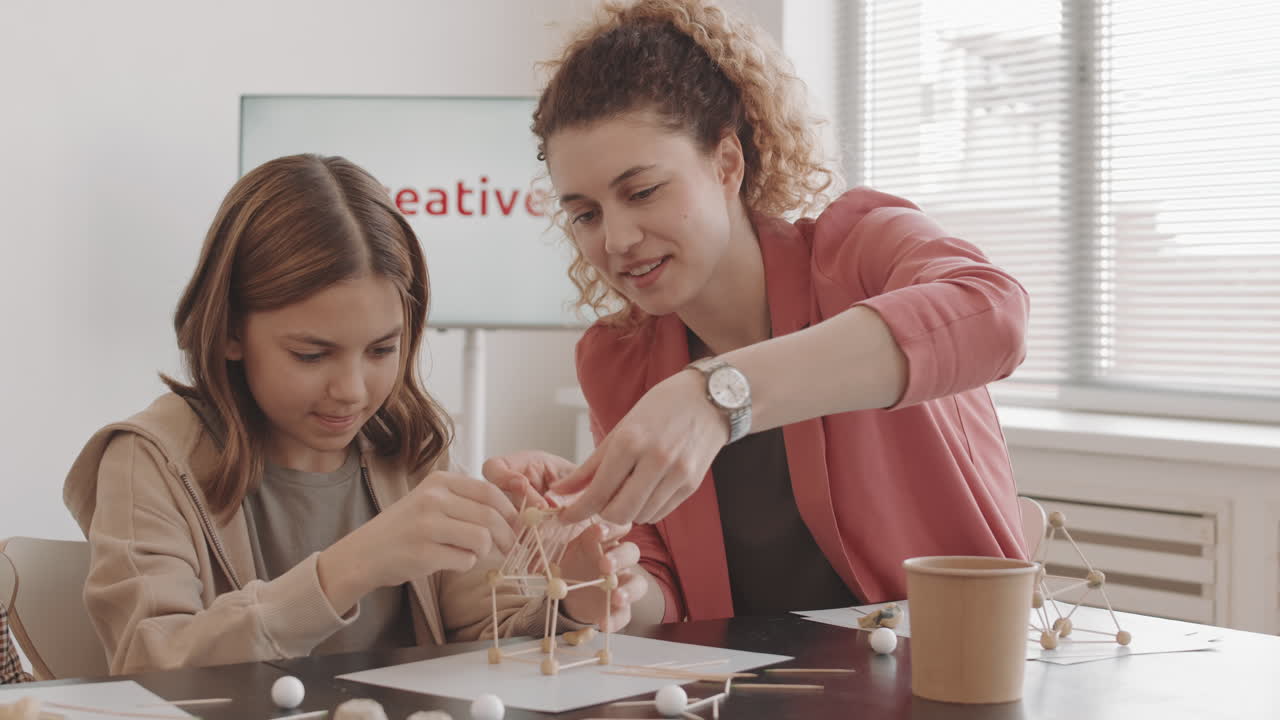 Mother Helping Daughter with School Project