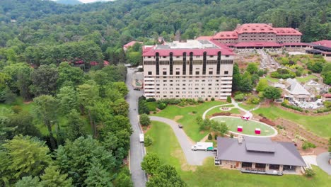 4k drone video of convention center, spa and golf course at historic grove park inn in asheville, nc on sunny summer day-2