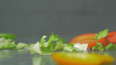 fresh, multicolor, mixed vegetables falling, splashing water, close-up