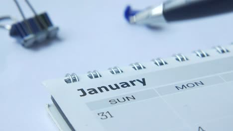 january calendar with a pen