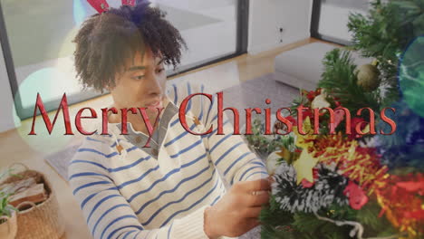 decorating christmas tree, person with merry christmas text animation over scene