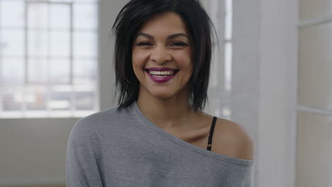 portrait of independent young mixed race woman laughing cheerful looking at camera enjoying positive lifestyle