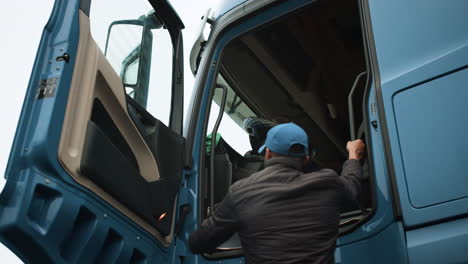 truck driver getting in truck