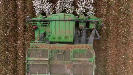 Cotton-picker-harvesting-a-field,-Top-down-aerial-view