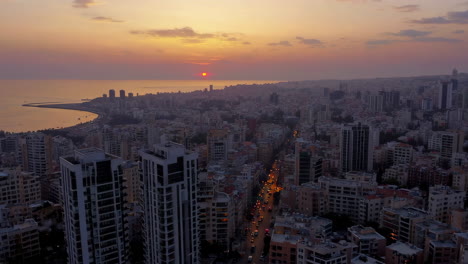 aerial view of a coastal city at sunset