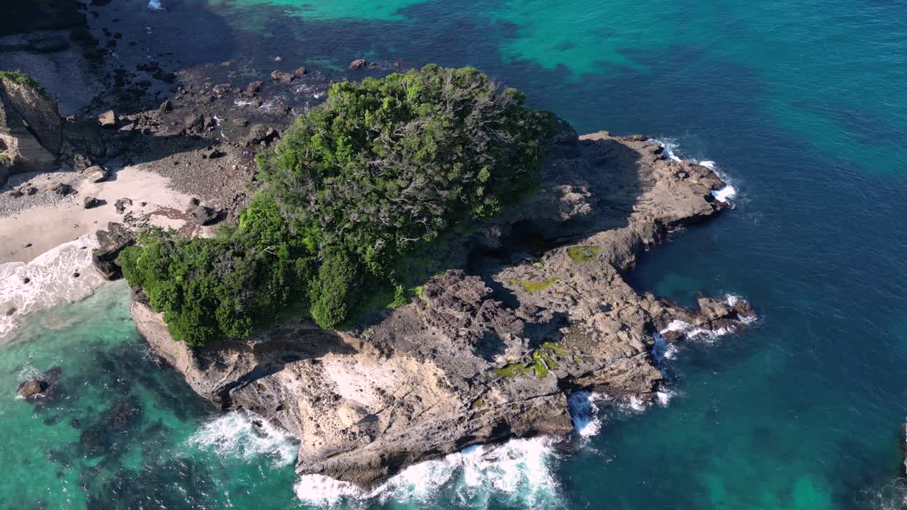 Perfect tiny island in the middle of ocean, drone flight