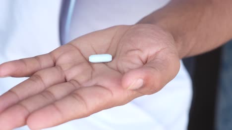 doctor holding a pill