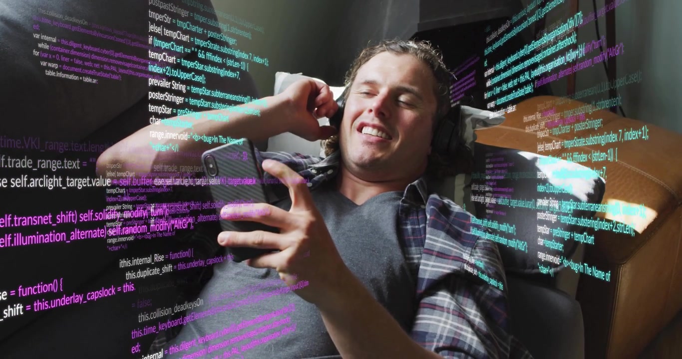 Young Man Relaxing on Couch with Digital Code Overlay