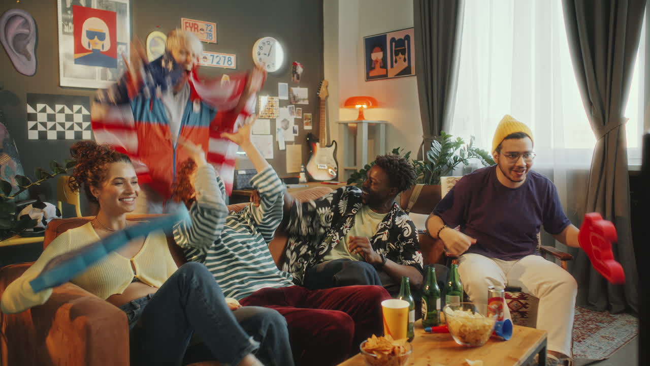 Friends Watching Sports on TV and Celebrating Goal with USA Flag