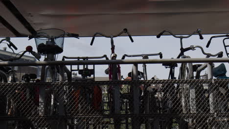 row of bicycles at a bike park in amsterdam, netherlands, wide shot