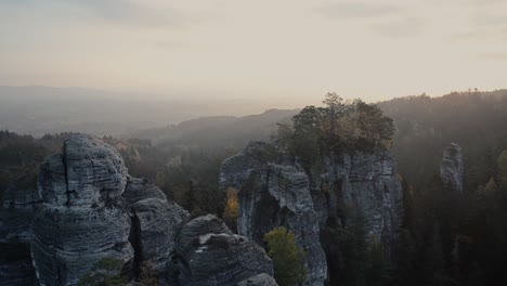 autumn sunrise above rocks in hruboskalsko, czechia