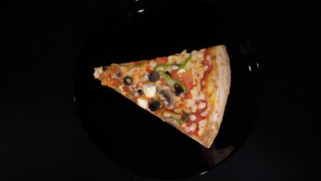 piece slice of pizza with vegetables and cheese. olives, pepper and tomato