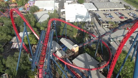 people rides a rollercoaster at an amusement park