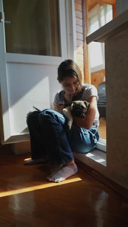 girl holding a puppy